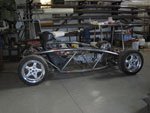 Bare Chevron car chassis in the workshop